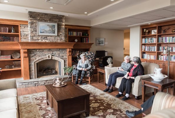 Residents engaged in a cozy common area