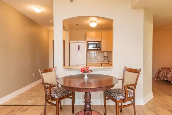 Cozy dining area with a table and kitchenette