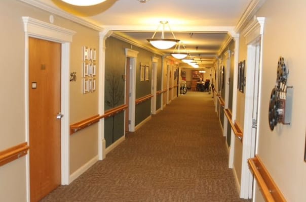 A hallway with doors and lighting in the facility