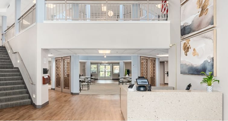 Interior view of the lobby with a reception desk and seating area.