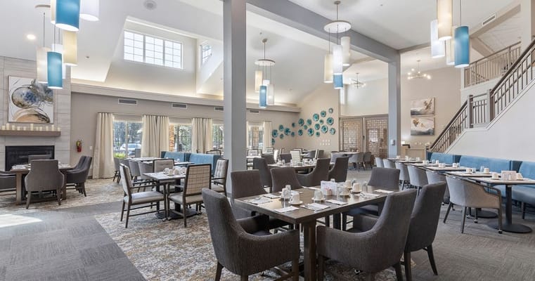 Modern dining area with tables and chairs at Solista High Point