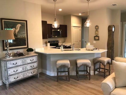 Open kitchen with modern appliances and seating