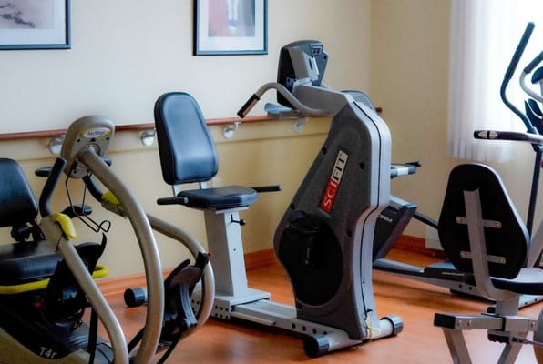 Exercise equipment in a senior living facility gym