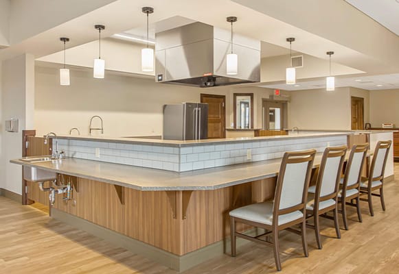 Spacious kitchen area with a countertop and seating at Southwest Montana Veteran's Home