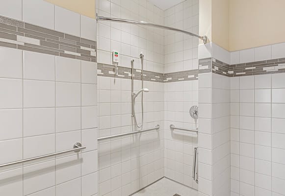 Spacious accessible shower with grab bars