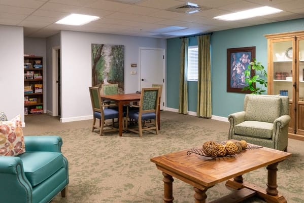 Cozy common room with seating and a dining table