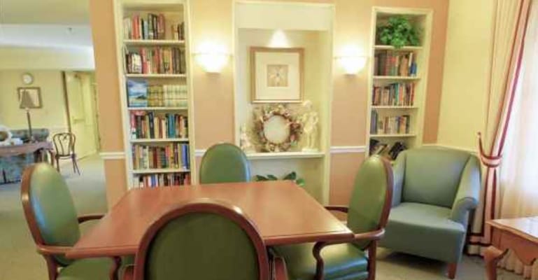 Cozy common area with bookshelves and seating