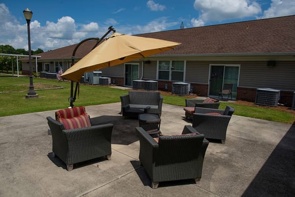 Cozy outdoor seating area with umbrellas and chairs