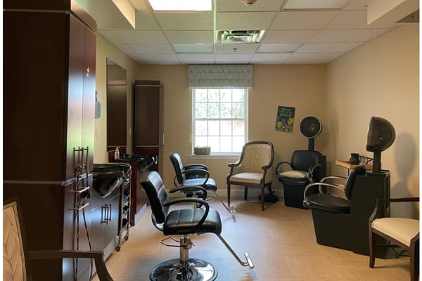 Interior of hair salon with styling chairs and natural light.