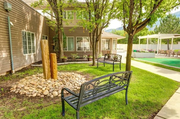 Outdoor seating area with benches and landscaping