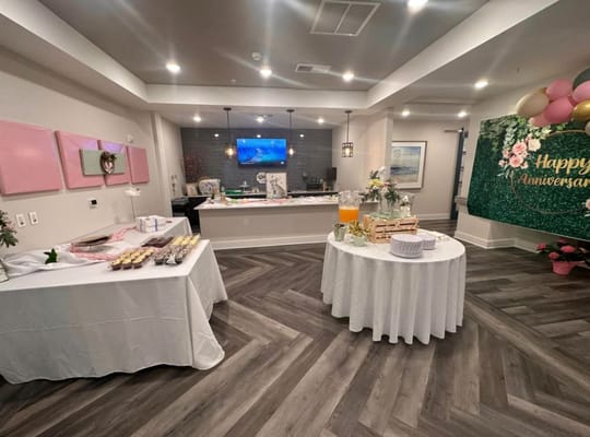 Decorative setup for an anniversary celebration in a common area