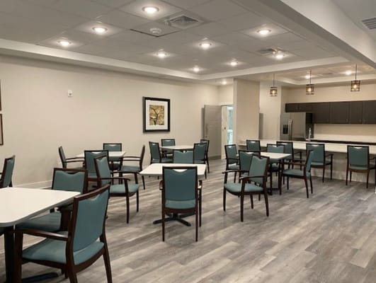Bright dining room with tables and chairs
