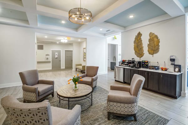 Modern living room with seating area and refreshments