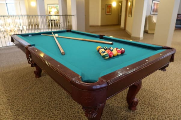 A pool table in a common area
