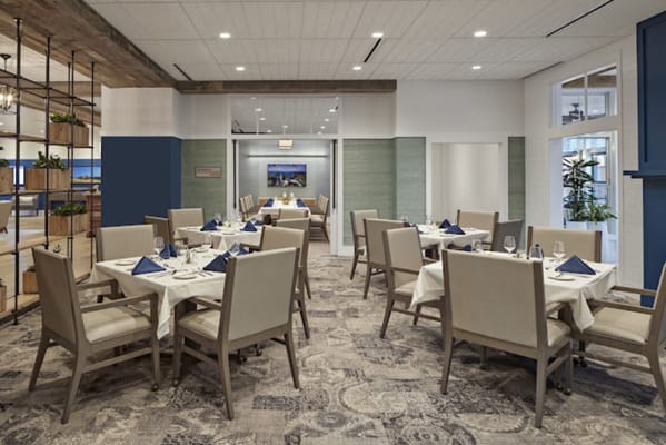 Elegant dining room setup with tables and settings