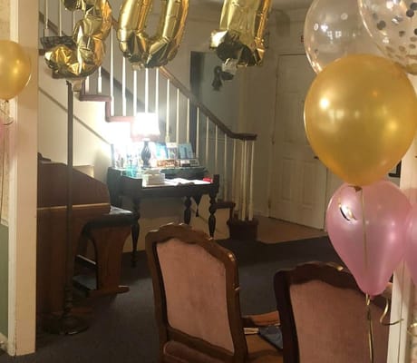 Decorated lobby area with balloons for a celebration