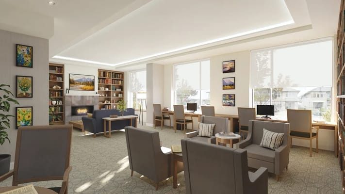 Bright common area with seating and bookshelves