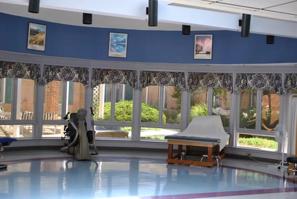 Interior space with large windows and recreational equipment