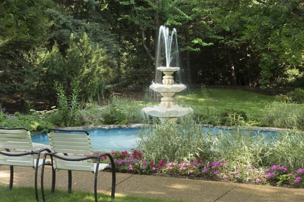 Beautiful garden with a fountain and seating area