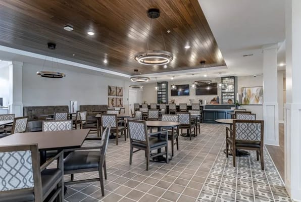 Dining area with tables and chairs in a bright interior