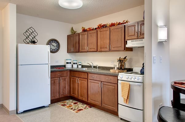 Kitchen with modern appliances and wooden cabinets