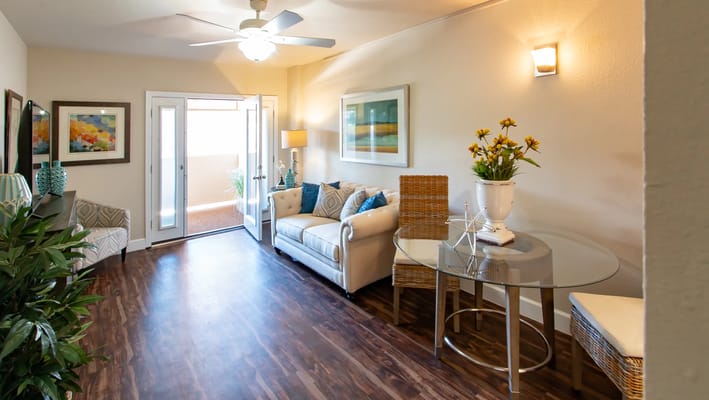 Bright communal living area with seating and decor