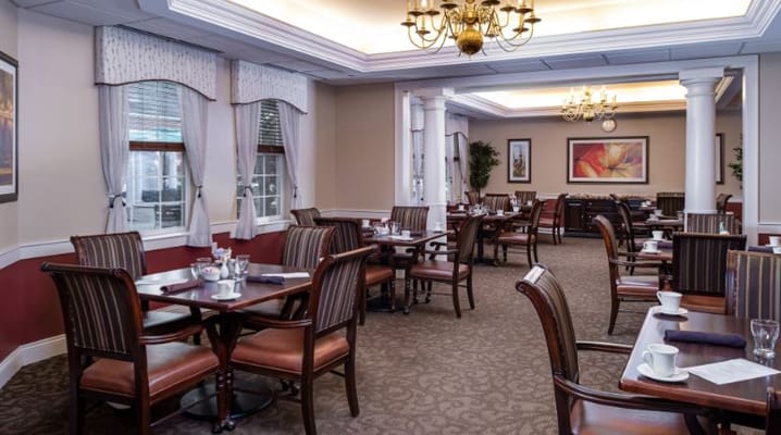 Elegant dining room setup with tables and chairs