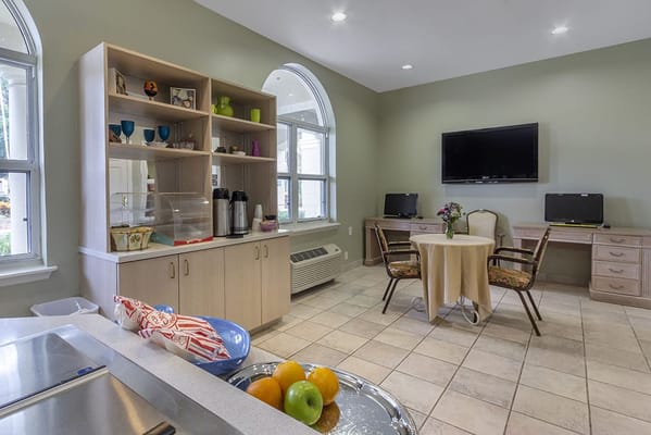 Interior space with a table and fruit on display