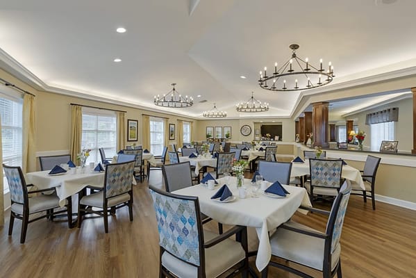 Elegant dining room setup with tables and chairs