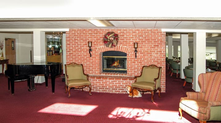 Cozy common area with a fireplace and seating