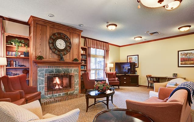 Cozy common area with a fireplace and seating