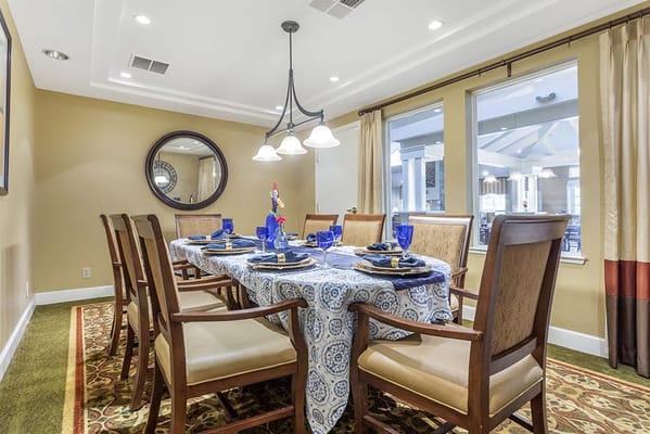 Dining room setup with a large table and elegant decor