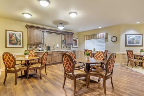 Dining area with tables and chairs in a cozy setting