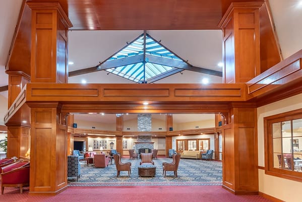 Bright common area with comfortable seating and high ceilings