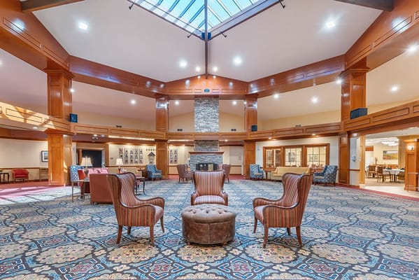 Bright, spacious interior common area with seating