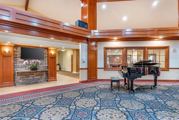 Interior view of a common area with a piano