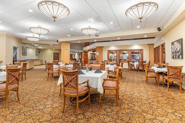 Interior view of a dining room with tables and chairs