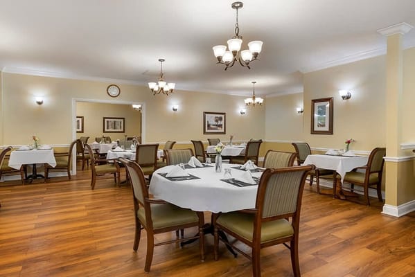 Dining room setup with elegant tables and lighting