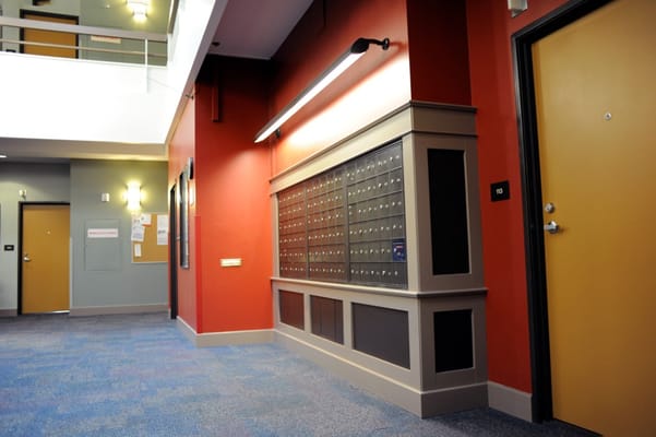 Interior hallway with mailboxes and doors
