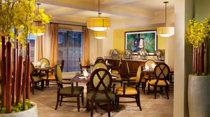 Bright dining room setup with tables and chairs