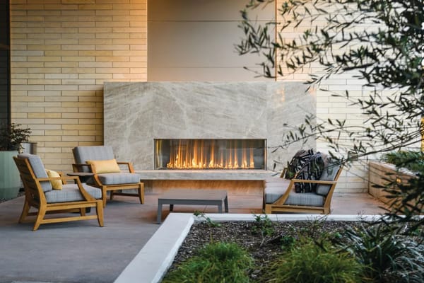 Cozy outdoor seating area with a fireplace