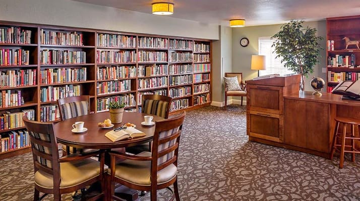 Cozy library with bookshelves and seating area