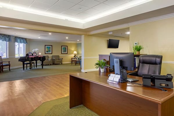 Reception area with comfortable seating and a piano