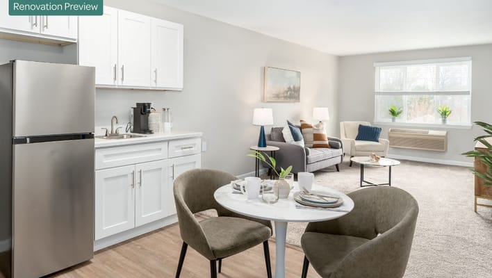 A cozy renovated apartment featuring a kitchen, dining area, and living room.