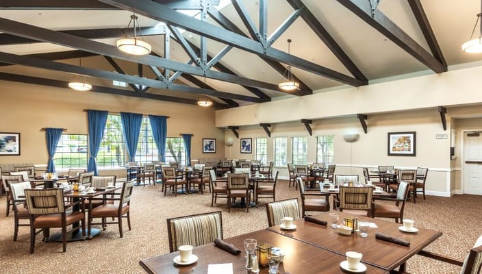 Bright dining area with tables and chairs