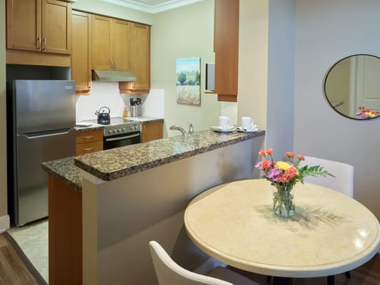 Bright interior of a kitchenette with a dining table