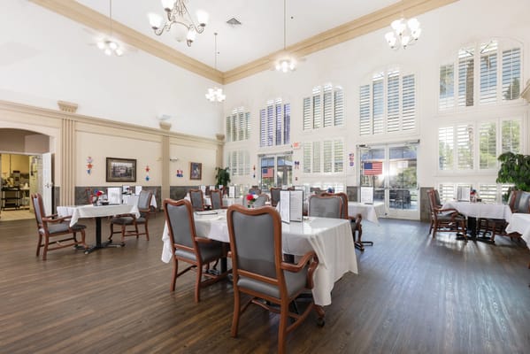 Bright dining room with tables and chairs