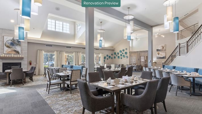 Bright and spacious dining room with tables set for meals