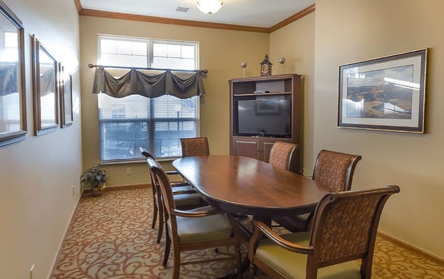 Common area with a large table and chairs