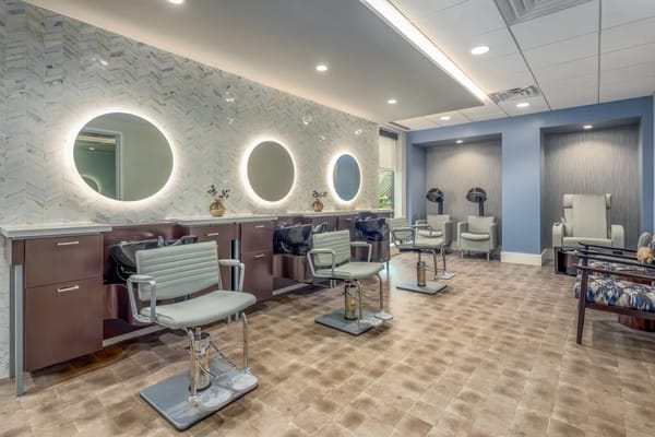 Interior view of a hair salon with styling chairs